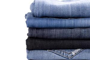 stack of blue jeans photo