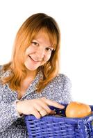 woman with a basket full of apples photo