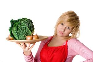 woman with fresh savoy cabbage and onions photo