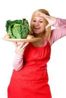 woman with fresh savoy cabbage and onions photo