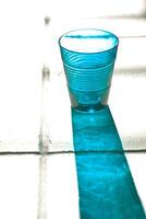 blue empty glass with reflection photo