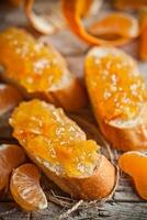 pieces of baguette with orange marmalade photo