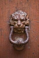 Ancient italian lion shaped door knocker photo