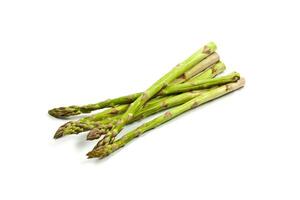 Bunch of fresh raw garden asparagus isolated on white background. photo