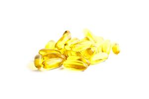 Fish oil capsules source of high omega-3 and vitamin for health care isolated on white background. photo
