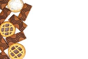 Cake bars filled with cream and tarts with dark chocolate isolated on white background. photo