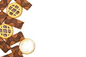 Cake bars filled with cream and tarts with dark chocolate isolated on white background. photo