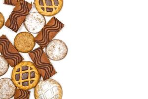 Cake bars filled with cream, oat cookies and tarts with dark chocolate isolated on white background. photo