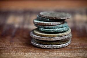 Stack of different ancient copper coins with patina. photo