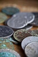 Tarnished and partially corroded old copper coins photo