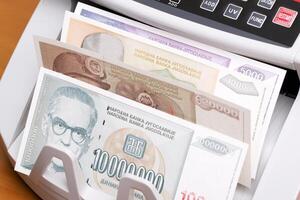 Yugoslav dinar in the counting machine photo