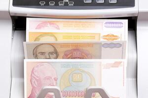 Yugoslav dinar in the counting machine photo
