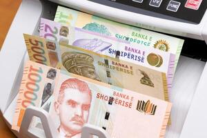Albanian lek in the counting machine photo