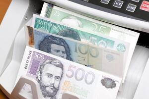 Estonian kroon in the counting machine photo