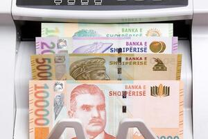 Albanian lek in the counting machine photo
