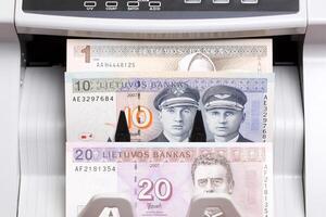Lithuanian litas in the counting machine photo