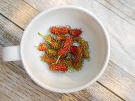 Top view of fresh ripe mulberries fruit, Ripe red mulberries photo