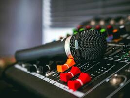 Close-up microphone on sound mixer in live broadcasting studio producer for sound record control system production and audio equipment and music instrument photo