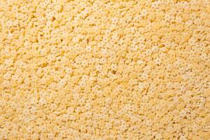 Uncooked Stelline Pasta. A Culinary Canvas of Stelline Macaroni, Creating a Lively and Textured Background for Gourmet Cooking. Dry Pasta. Raw Macaroni - Top View, Flat Lay photo