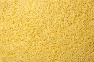 Uncooked Filini Pasta. A Culinary Canvas of Noodles, Creating a Lively and Textured Background for Gourmet Cooking. Dry Pasta. Raw Macaroni - Top View, Flat Lay photo