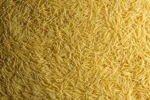 Uncooked Filini Pasta. A Culinary Canvas of Noodles, Creating a Lively and Textured Background for Gourmet Cooking. Dry Pasta. Raw Macaroni - Top View, Flat Lay photo