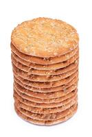 A Stack of Round Salt Crackers with Sesame Isolated on White Background. Dry Snacks - Isolation photo
