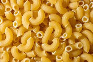 Uncooked Chifferi Rigati Pasta. A Culinary Canvas of Chifferi Rigati, Creating a Lively and Textured Background for Gourmet Cooking. Dry Pasta. Raw Macaroni - Top View, Flat Lay photo