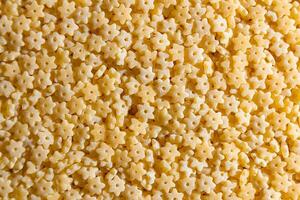 Uncooked Stelline Pasta. A Culinary Canvas of Stelline Macaroni, Creating a Lively and Textured Background for Gourmet Cooking. Dry Pasta. Raw Macaroni - Top View, Flat Lay photo