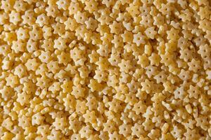 Uncooked Stelline Pasta. A Culinary Canvas of Stelline Macaroni, Creating a Lively and Textured Background for Gourmet Cooking. Dry Pasta. Raw Macaroni - Top View, Flat Lay photo
