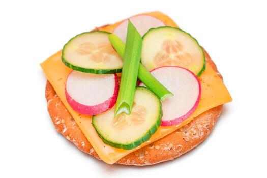 Light Breakfast. Quick and Healthy Sandwich. Fresh Cucumber and Radish with Green Onions and Cheese on Crispy Cracker - Isolated on White photo