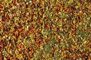 Vibrant and Colored Vegetable Seasoning Mix. A Culinary Canvas of Aromatic Seasoning - Textured Background for Gourmet Cooking. The Harmonious Combination of Fresh Herbs and Spices - Top View photo