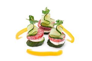 Canapes without Bread with Salami, Cucumber, Greens and Cream Cheese - Isolated on White Background. Easy Breakfast. Diet Food. Quick and Healthy Sandwiches. Healthy Snacks with Tasty Fillings photo