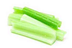 Fresh Chopped Celery Sticks with Water Drops Isolated on White Background. Vegan and Vegetarian Culture. Raw Food. Healthy Diet with Negative Calorie Content photo
