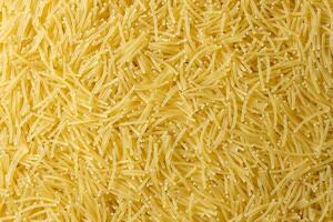 Uncooked Filini Pasta. A Culinary Canvas of Noodles, Creating a Lively and Textured Background for Gourmet Cooking. Dry Pasta. Raw Macaroni - Top View, Flat Lay photo