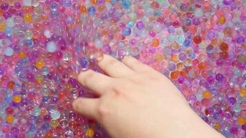 The girl's hand moves smoothly, in a circular motion hydrogel balls. Asmr Part 2 video