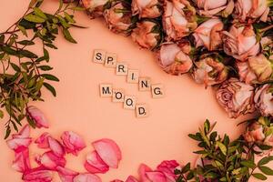 Beautiful roses lie on the table. Spring mood photo