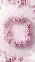 A pink frame surrounded by pink flowers photo