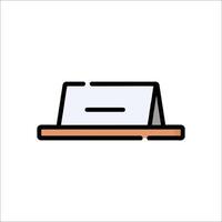 A flat icon of a desk with a book on it vector