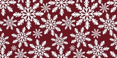 A seamless pattern of hand-drawn snowflakes on a red background vector