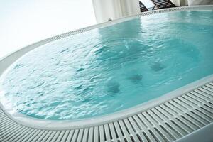Relaxing in a Luxurious Hot Tub on a Sunny Day With a Stunning Ocean View photo