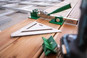 Tools Arranged on Wooden Planks for Precise Measurement and Alignment in Carpentry Workshop photo