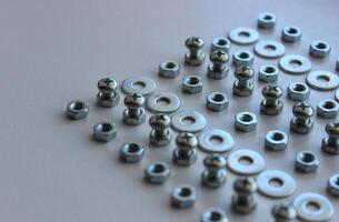 Lined Up Hardware Fixing Items On White Table Closeup Stock Photo