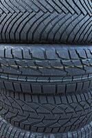 Different designs of winter tire tread blocks for different operating conditions. Tread pattern of variety winter tires vertical image photo