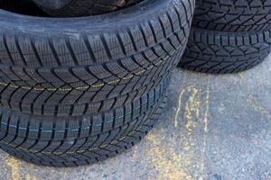 Variety Studless Car Tires For Mud And Snow In A Stack On The Road. Seasonal Tires Change Image photo