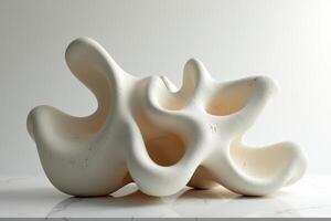 A sculpture made of white clay on a white surface photo