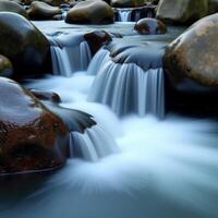 A river flowing over rocks in a stream photo