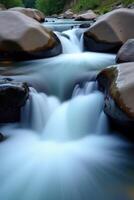 A river flowing through rocks and water photo