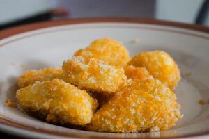 Fried banana snack wrapped in corn, tasty and crispy photo