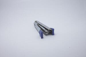 paper stapler isolated on white background photo
