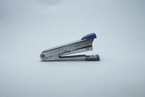 paper stapler isolated on white background photo